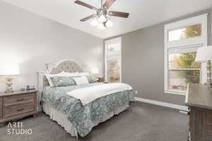 Bedroom with dark colored carpet and a ceiling fan