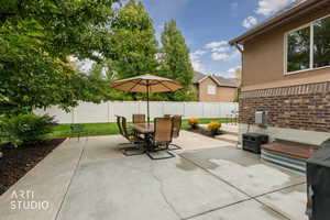 Fenced backyard featuring outdoor dining area and a patio area