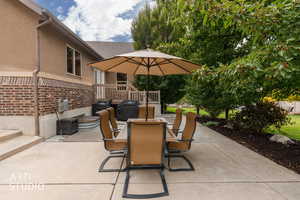 View of patio / terrace with outdoor dining area and a grill