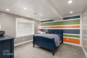 Bedroom with light carpet and recessed lighting