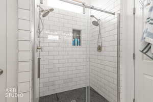 Bathroom featuring a shower stall