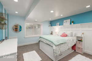 Bedroom featuring light colored carpet and recessed lighting