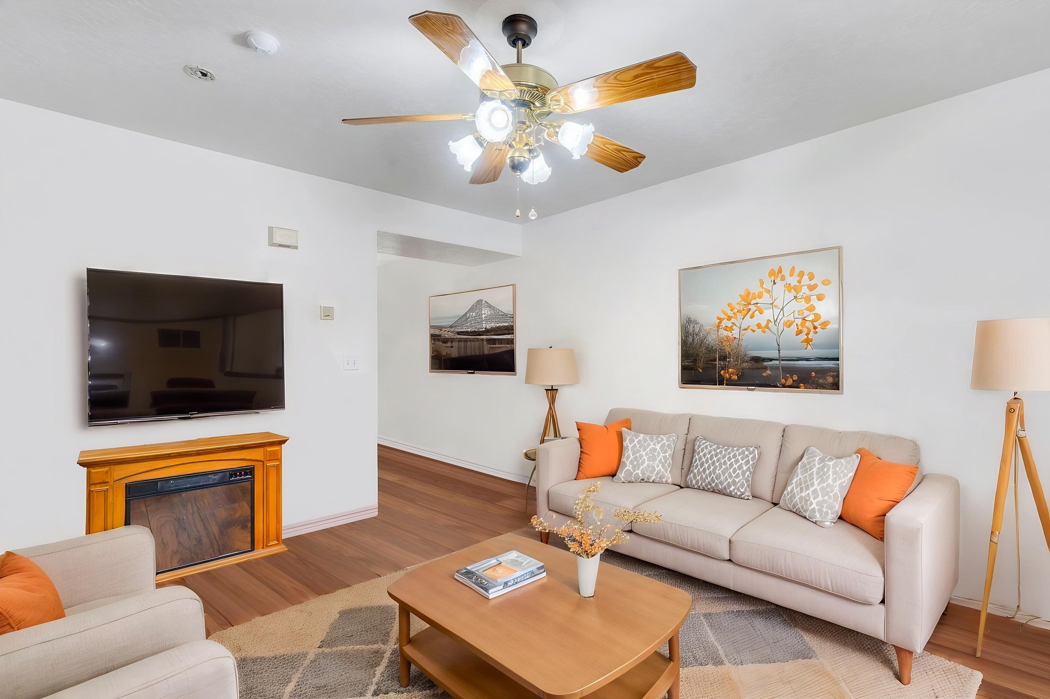 Living room with gas fireplace, digitally staged