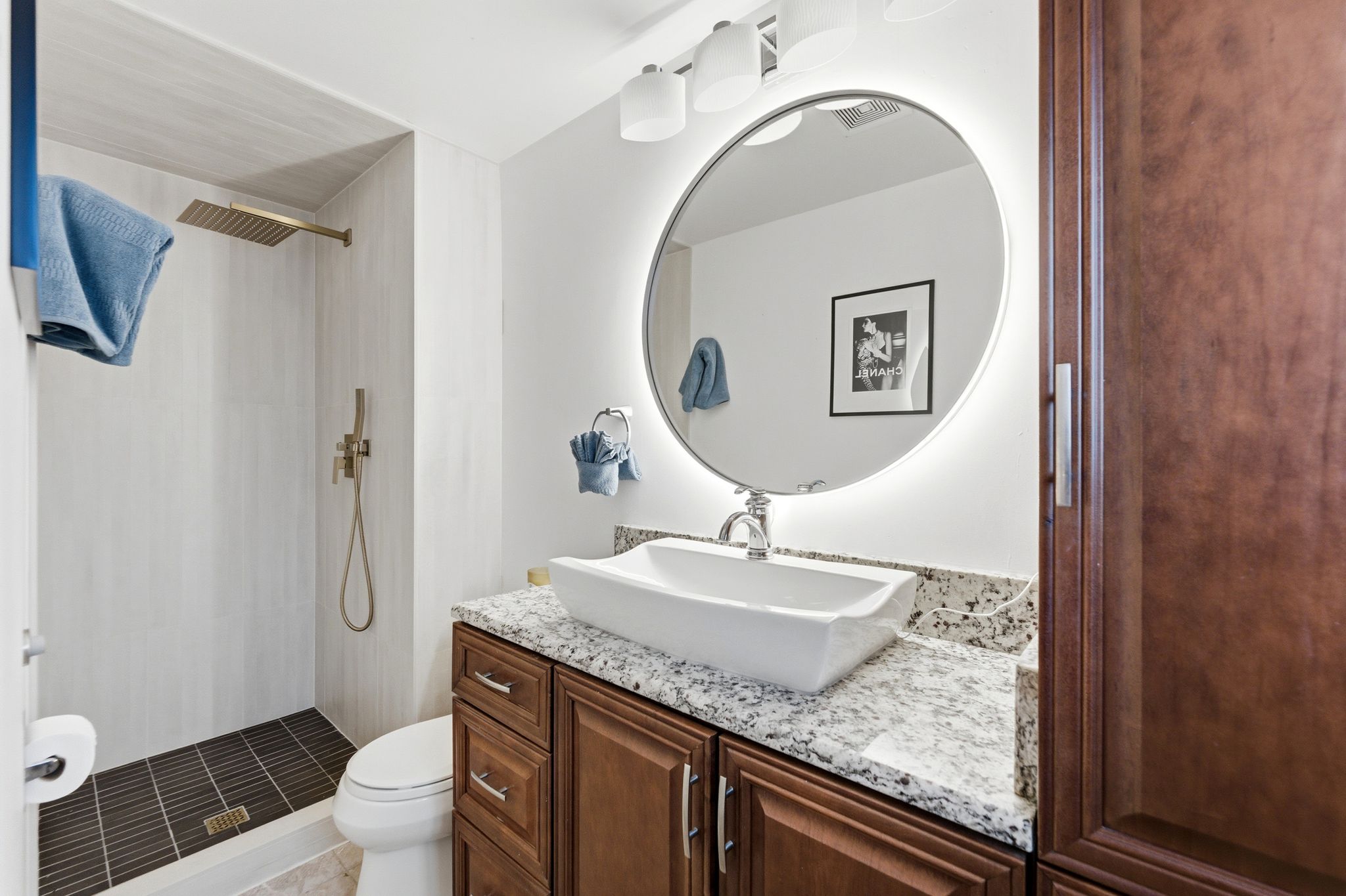 Full bath with vanity and a stall shower