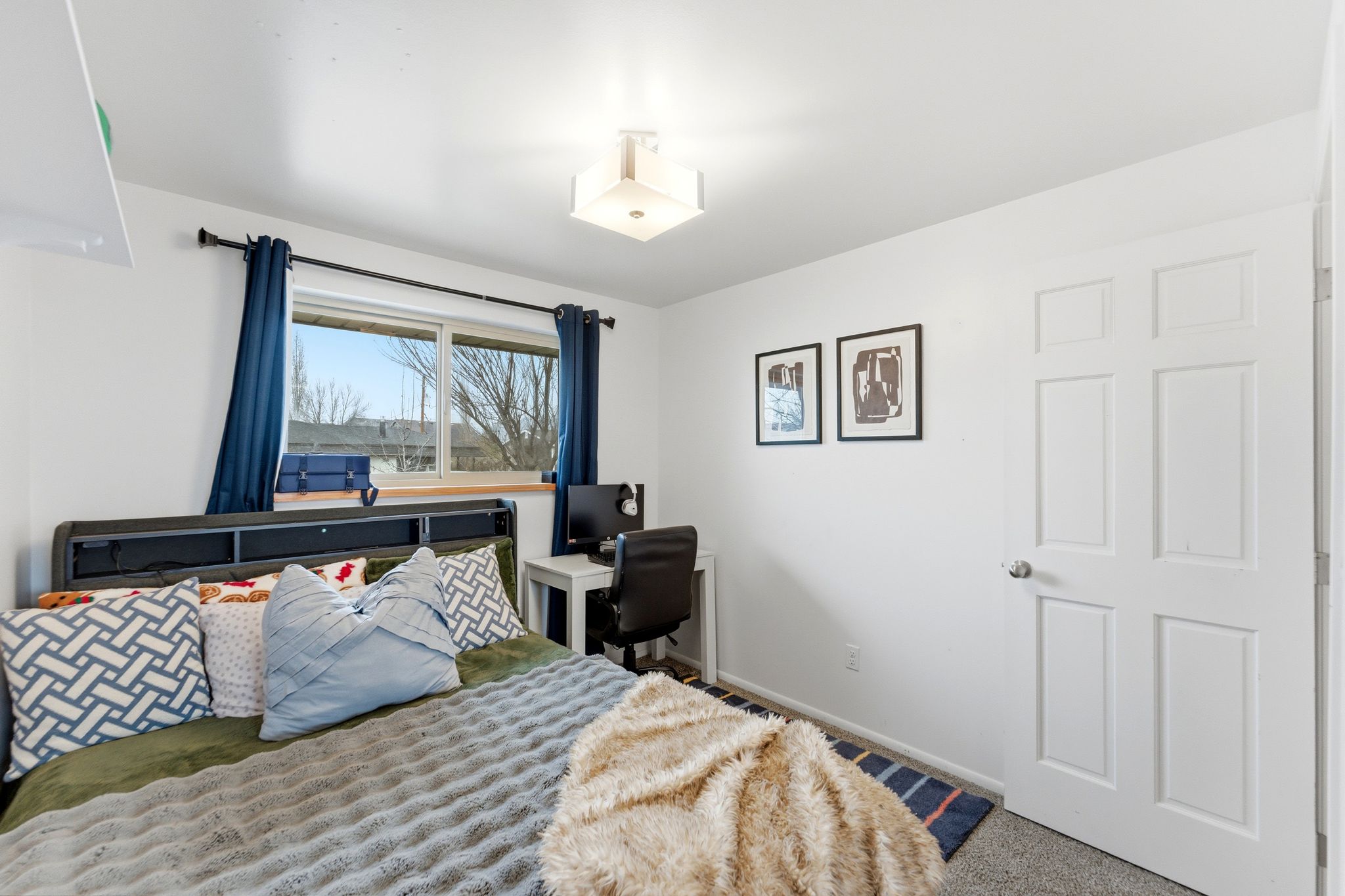 Bedroom featuring carpet flooring and baseboards
