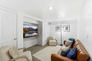 Living area with carpet floors and baseboards