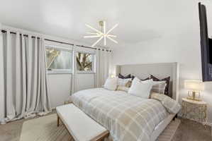 Bedroom with light carpet