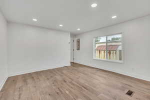 Spare room featuring recessed lighting and light wood-style flooring