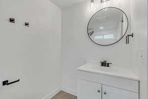 Bathroom with vanity and light tile patterned flooring