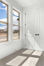Unfurnished bedroom featuring carpet flooring and baseboards