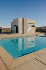 Community pool featuring a patio