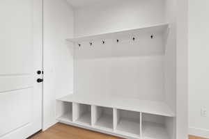Mudroom with light wood-style flooring