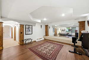 Exercise and dance room, dark wood flooring, and recessed lighting