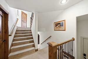 Staircase from the garage and connecting to the basement