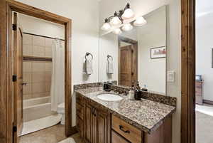 Jack & Jill bathroom,shower /tub combo and light tile flooring