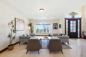 Living room with light tile patterned flooring