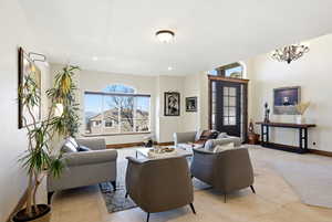 Living room featuring baseboards and light tile patterned flooring