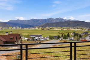 View of mountain background featuring nearby suburban area