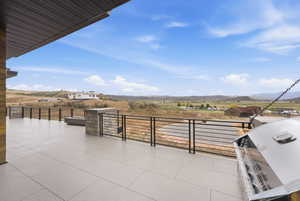 View of patio / terrace featuring a grill and a mountain view