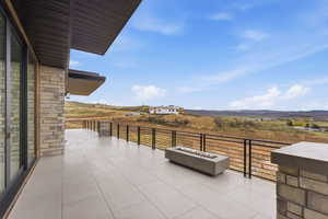 View of patio / terrace with an outdoor fire pit