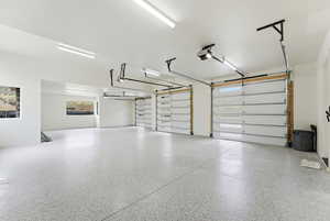 Garage featuring a garage door opener