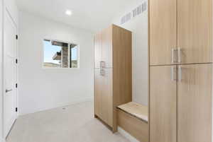 Mudroom with baseboards and recessed lighting