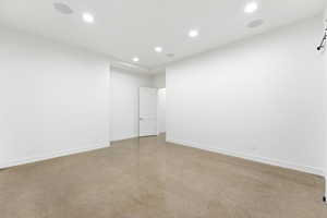 Empty room featuring recessed lighting and finished concrete floors