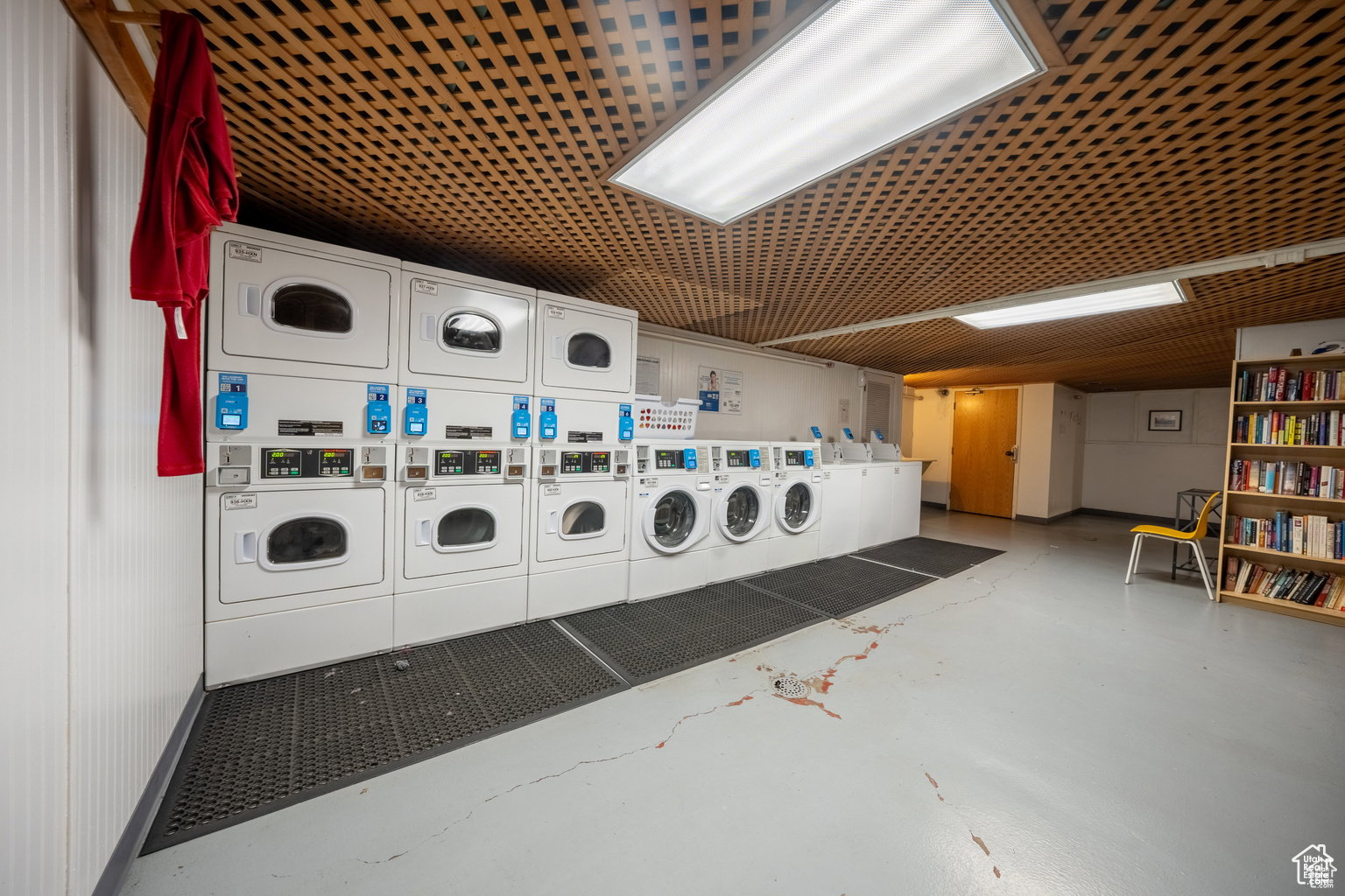 Shared laundry featuring separate washer and dryer
