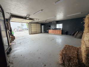 Garage featuring a heating unit