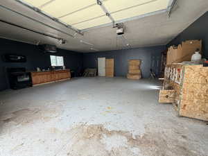 Garage featuring a heating unit