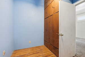Unfurnished bedroom featuring light wood-type flooring