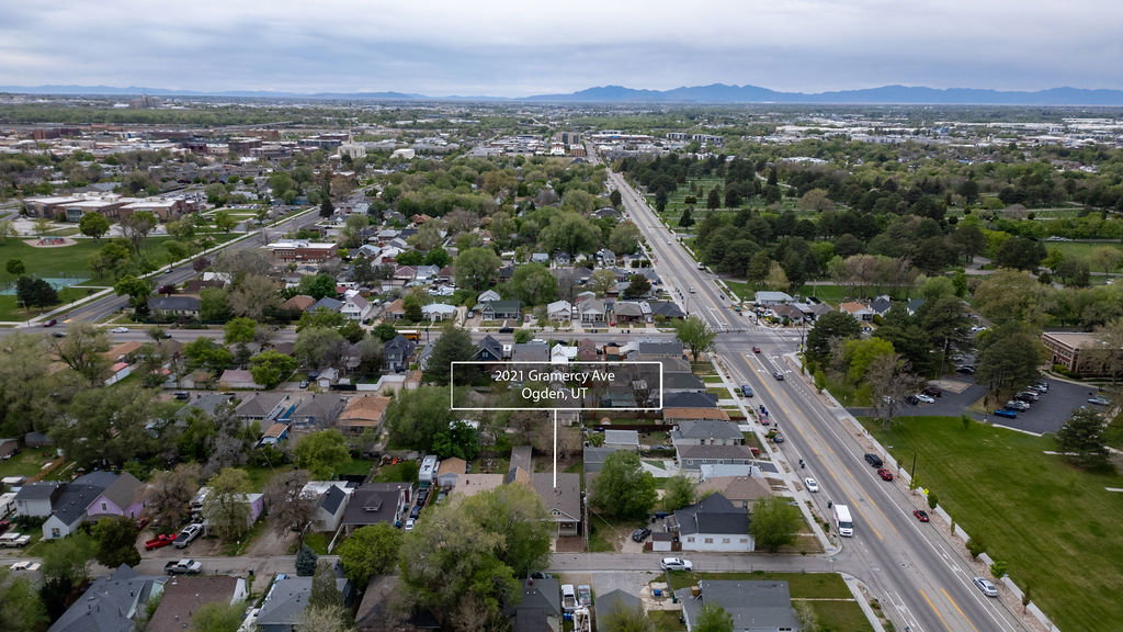 Aerial overview of property's location with property parcel outlined and nearby suburban area