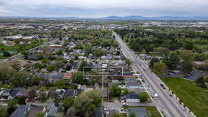 Aerial overview of property's location with property parcel outlined and nearby suburban area