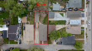 Aerial perspective of suburban area featuring property parcel outlined