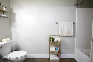 Basement bathroom with full tub/shower.