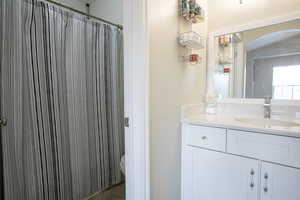 Full bath with vanity and a tub/shower.