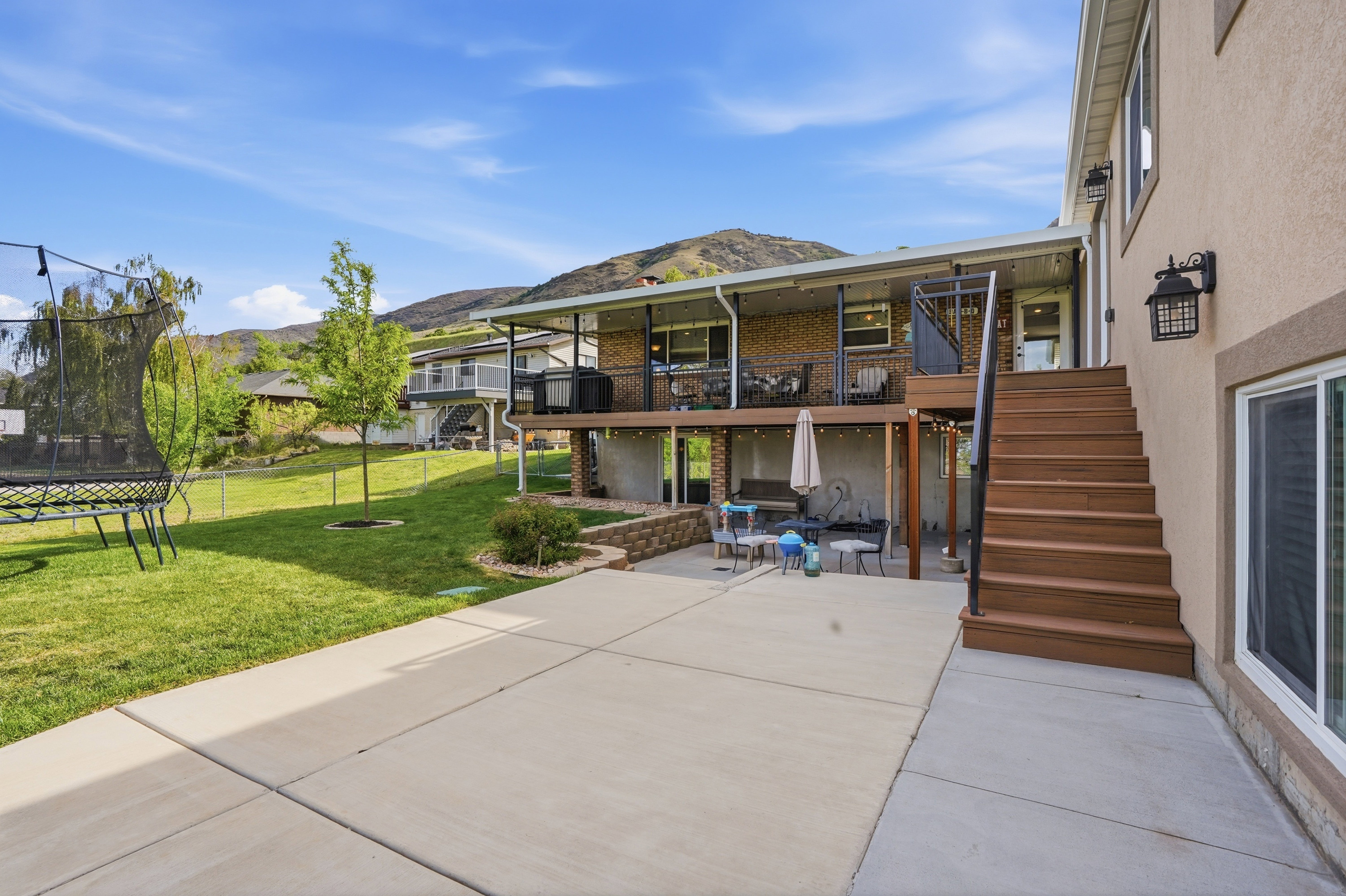 Deep deck with a large patio.  Perfect for dining out and parties