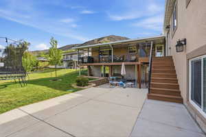 Deep deck with a large patio.  Perfect for dining out and parties