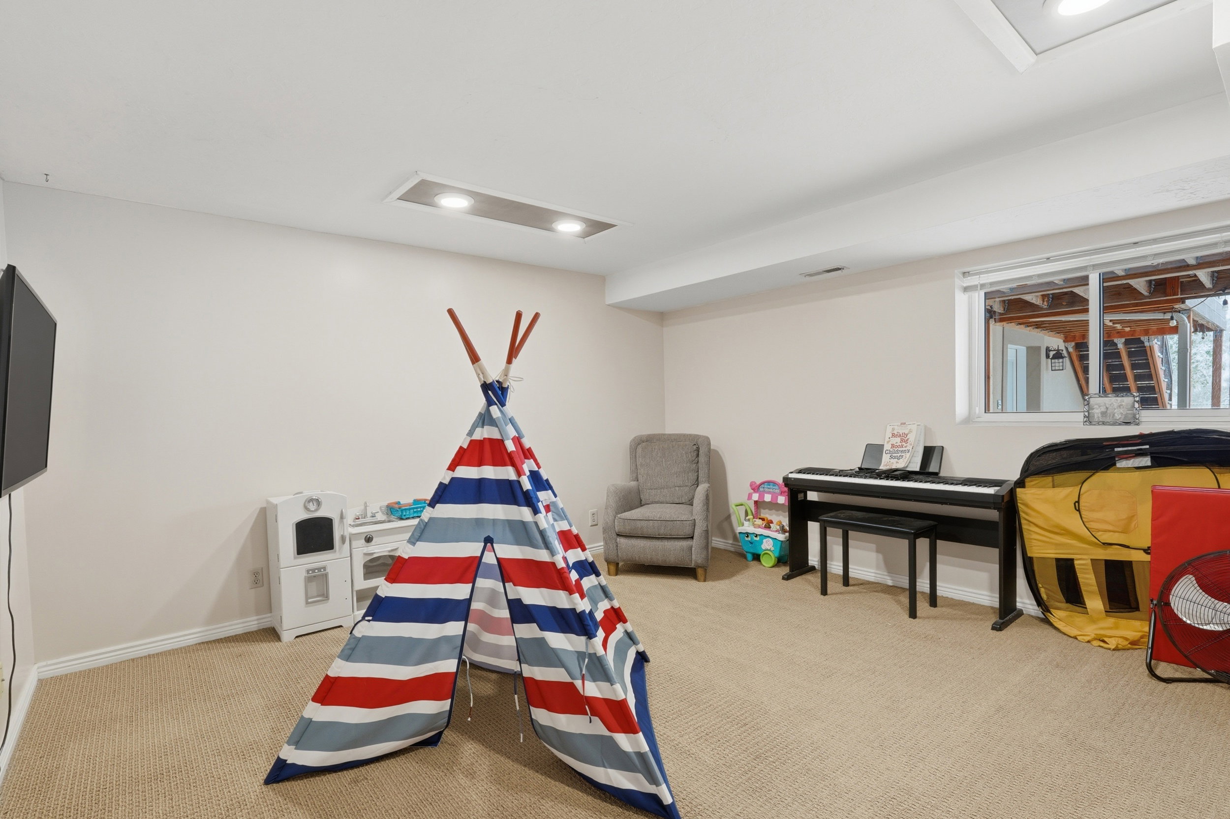lower level large bedroom currently used as a play room