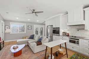 ADU Living room with french doors, light wood-style floors, a ceiling fan, and recessed lighting