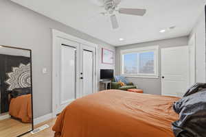ADU Bedroom with light wood-style floors, a ceiling fan, and recessed lighting