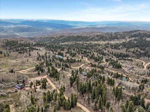 Bird's eye view of mountains and a heavily wooded area
