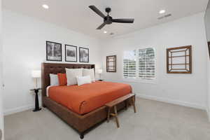 Bedroom featuring light colored carpet, ceiling fan, and recessed lighting