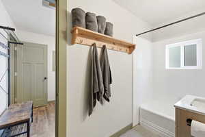 Full bathroom featuring vanity and washtub / shower combination