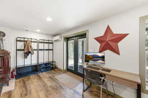 Downstairs living room with french doors, to access covered patio