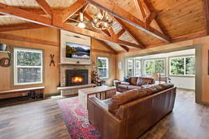 Living room featuring a wood burning fireplace,