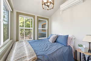 Main level bedroom with a wall mounted mini split