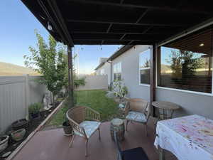 Fenced backyard with a patio