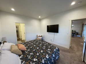 Bedroom with dark colored carpet and recessed lighting