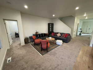 Living room featuring recessed lighting and carpet